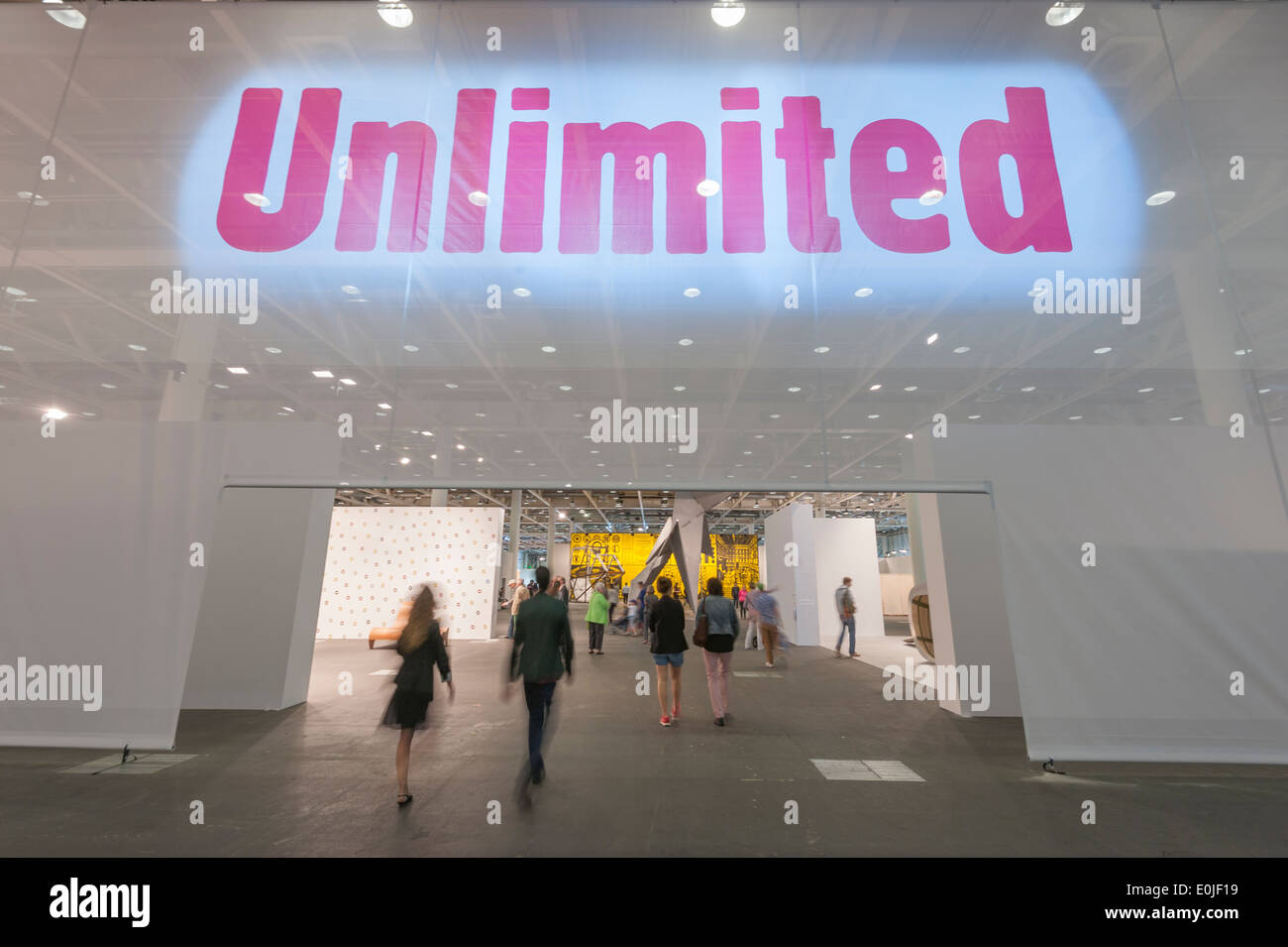 Visitors of the Art Basel 2013 in Basel, Switzerland, enter the main