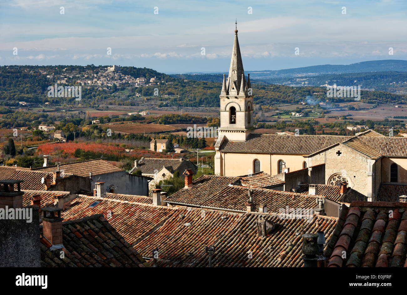 Luberon landscape view with cathedral of Bonnieux and Lacoste village in the back, Provence, France Stock Photo