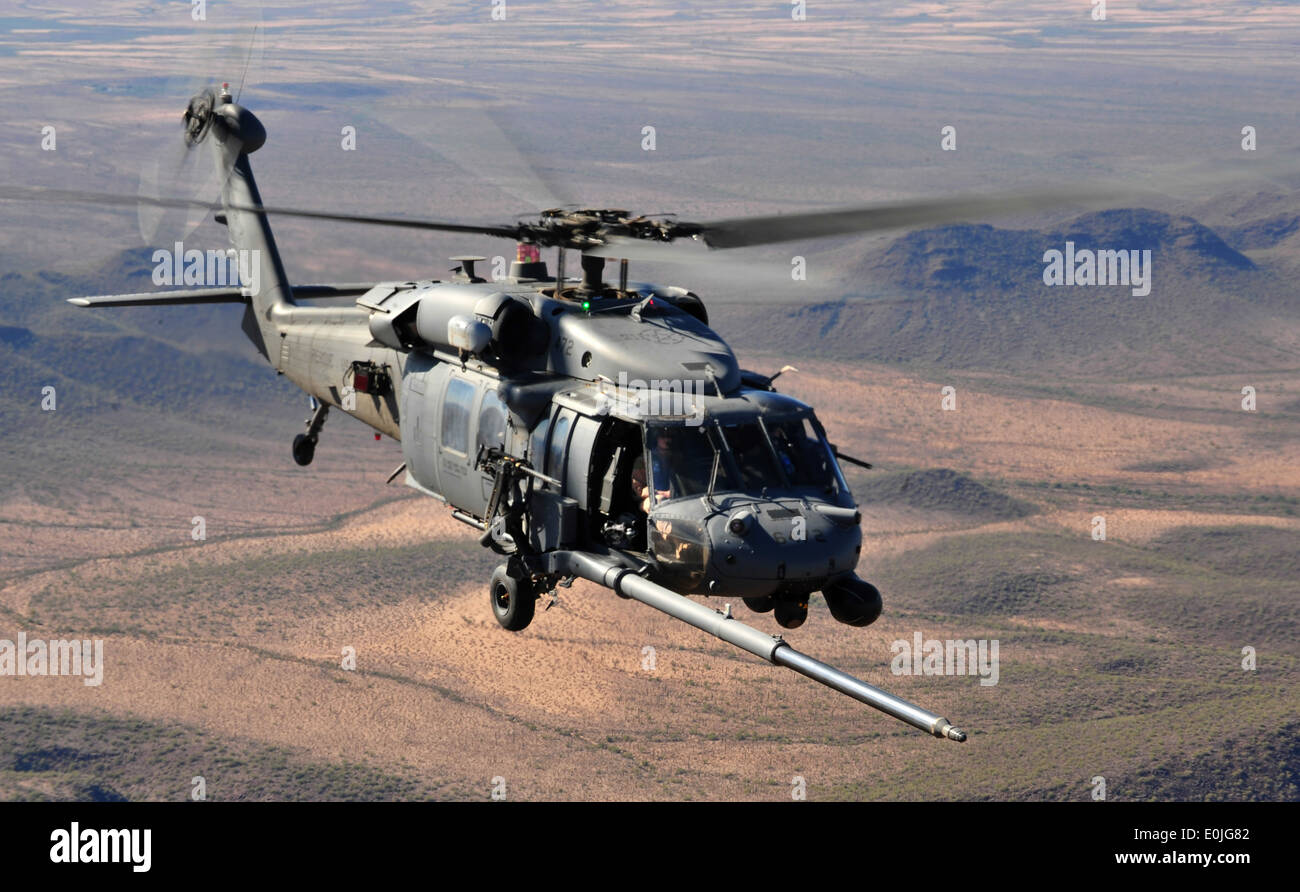U.S. Air Force HH-60 Pave Hawk helicopter assigned to the 66th Rescue Squadron Nellis AFB, Nev., maneuver behind a HC-130 to pe Stock Photo