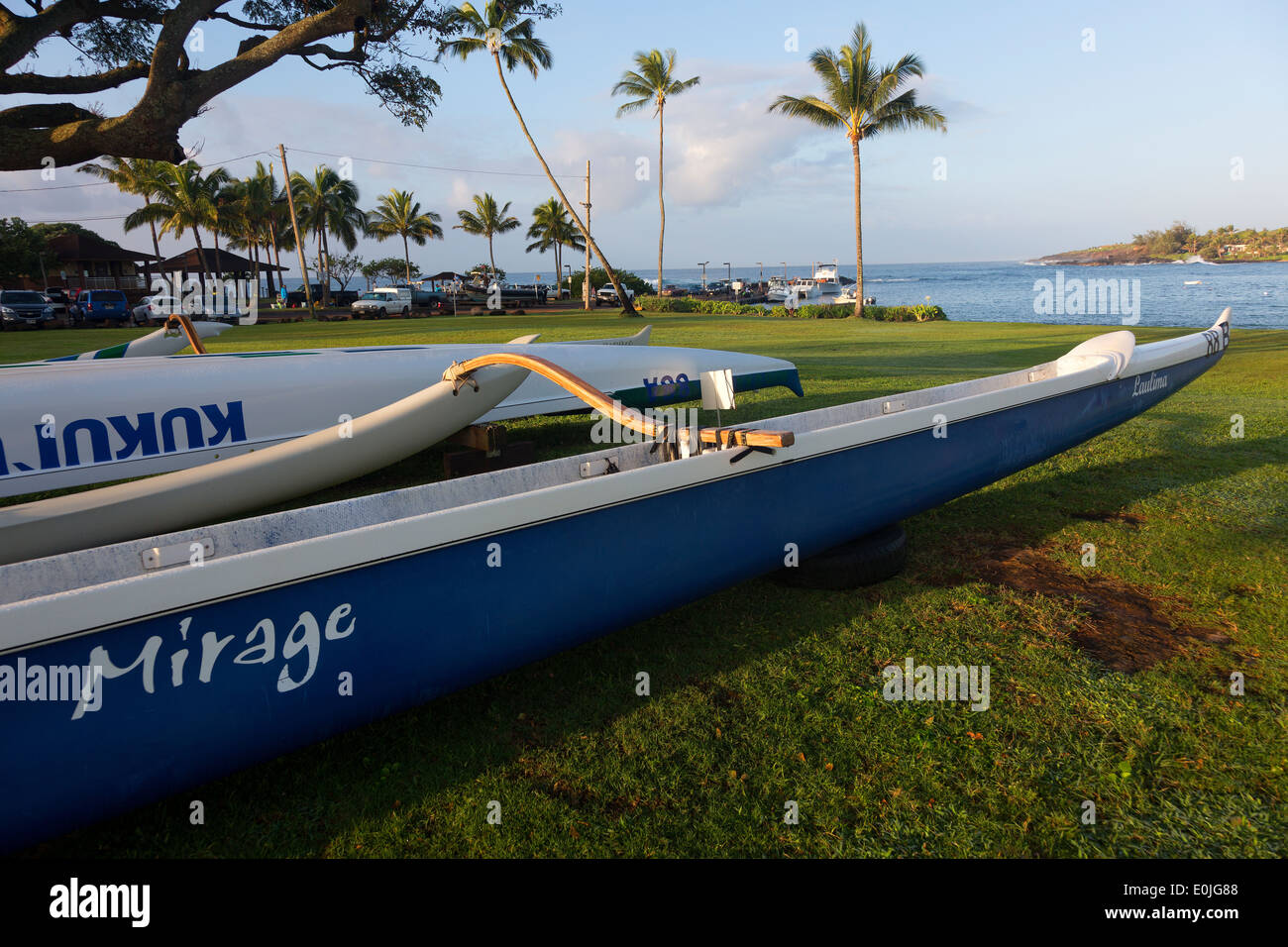 Outrigger boats at rest at Kukui'ula harbor Kauai, Hawaii Stock Photo