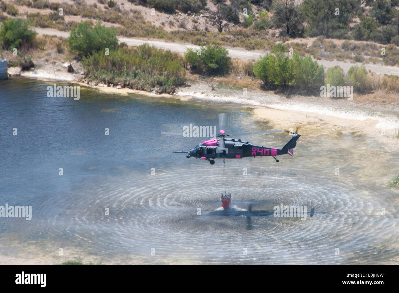 Two HH-60G Pave Hawk helicopters from the 129th Rescue Wing, Califorina Air National Guard, out of Moffett Field, and one UH-60 Stock Photo