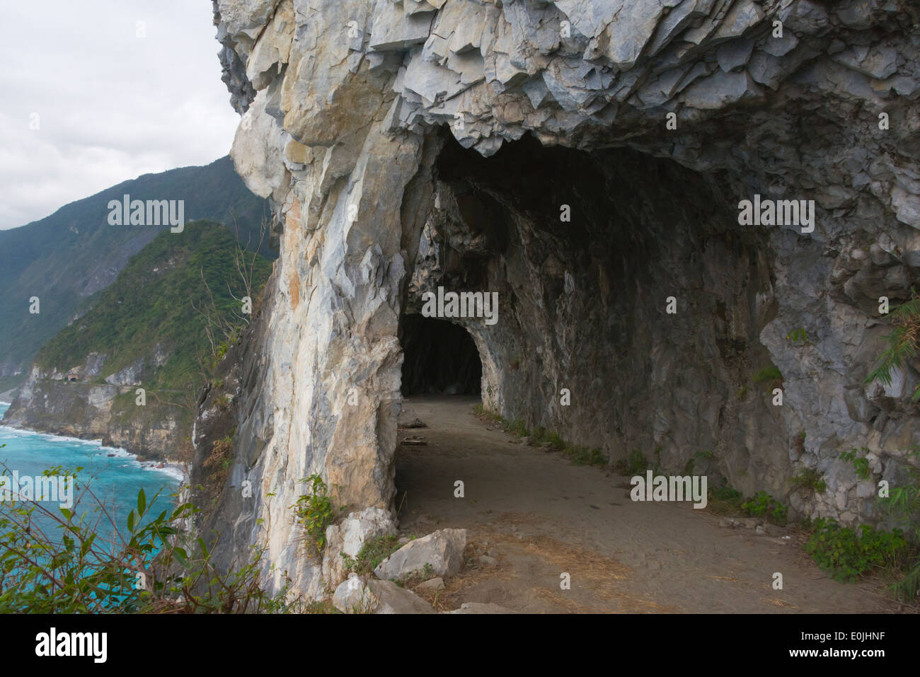 Cliff with a road built in along the east coast, Taiwan Stock Photo