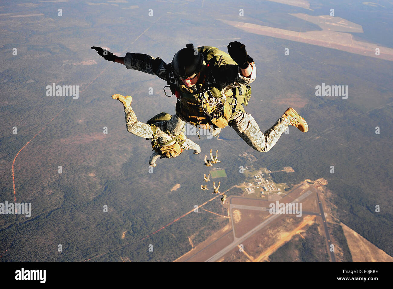 U.S. Army Special Forces soldiers practice high altitude low opening (H.A.L.O.) jumps out of a Royal Air Force C-130K during Em Stock Photo