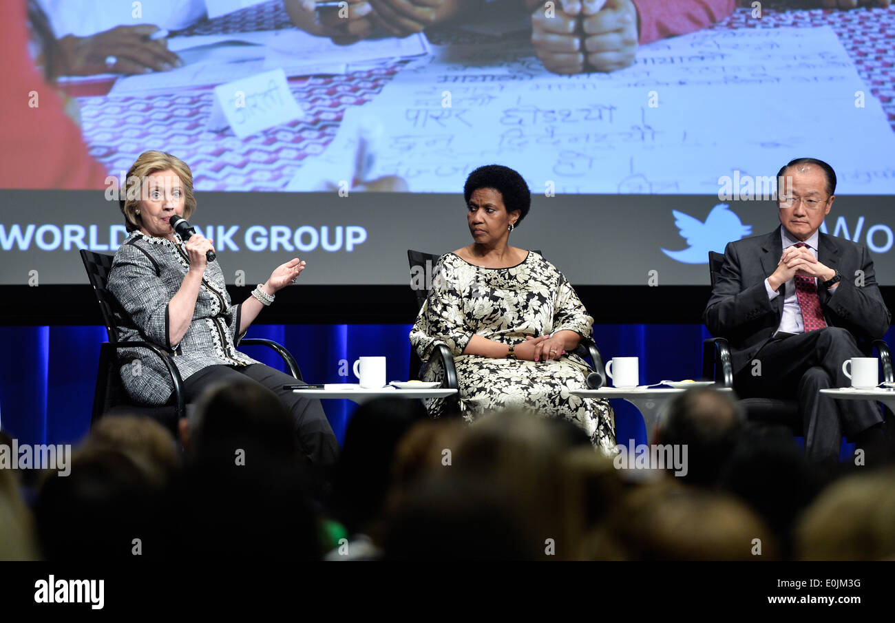 Washington DC, USA. 14th May, 2014. Former U.S. Secretary of State Hillary Clinton (L) speaks at the launch ceremony of World Bank Group's new report 'Voice and Agency: Empowering Women and Girls for Shared Prosperity finds' in Washington, DC, capital of the United States, May 14, 2014. Girls with little or no education are far more likely to be married as children, suffer domestic violence, live in poverty, and lack a say over household spending or their own health care than better-educated peers, according to the new report by the World Bank Group on Wednesday. Credit:  Xinhua/Alamy Live New Stock Photo