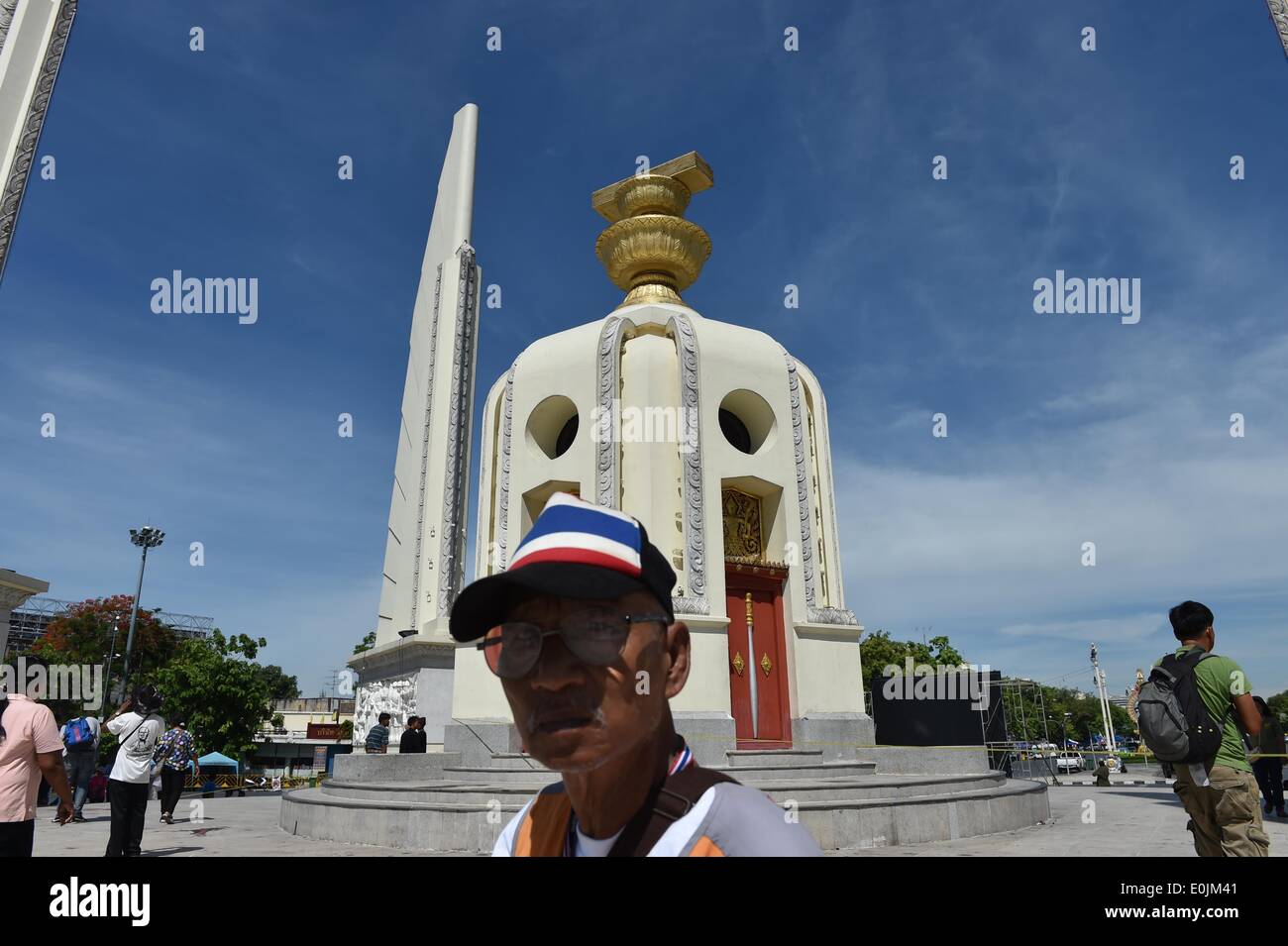 Bangkok, Thailand. 15th May, 2014. A man walks past the site of an attack near the Democracy Monument in Bangkok, Thailand, May 15, 2014. Two anti-government protestors were killed and 22 others injured in a gun and grenade attack here early Thursday, local media reported. © Lui Siu Wai/Xinhua/Alamy Live News Stock Photo