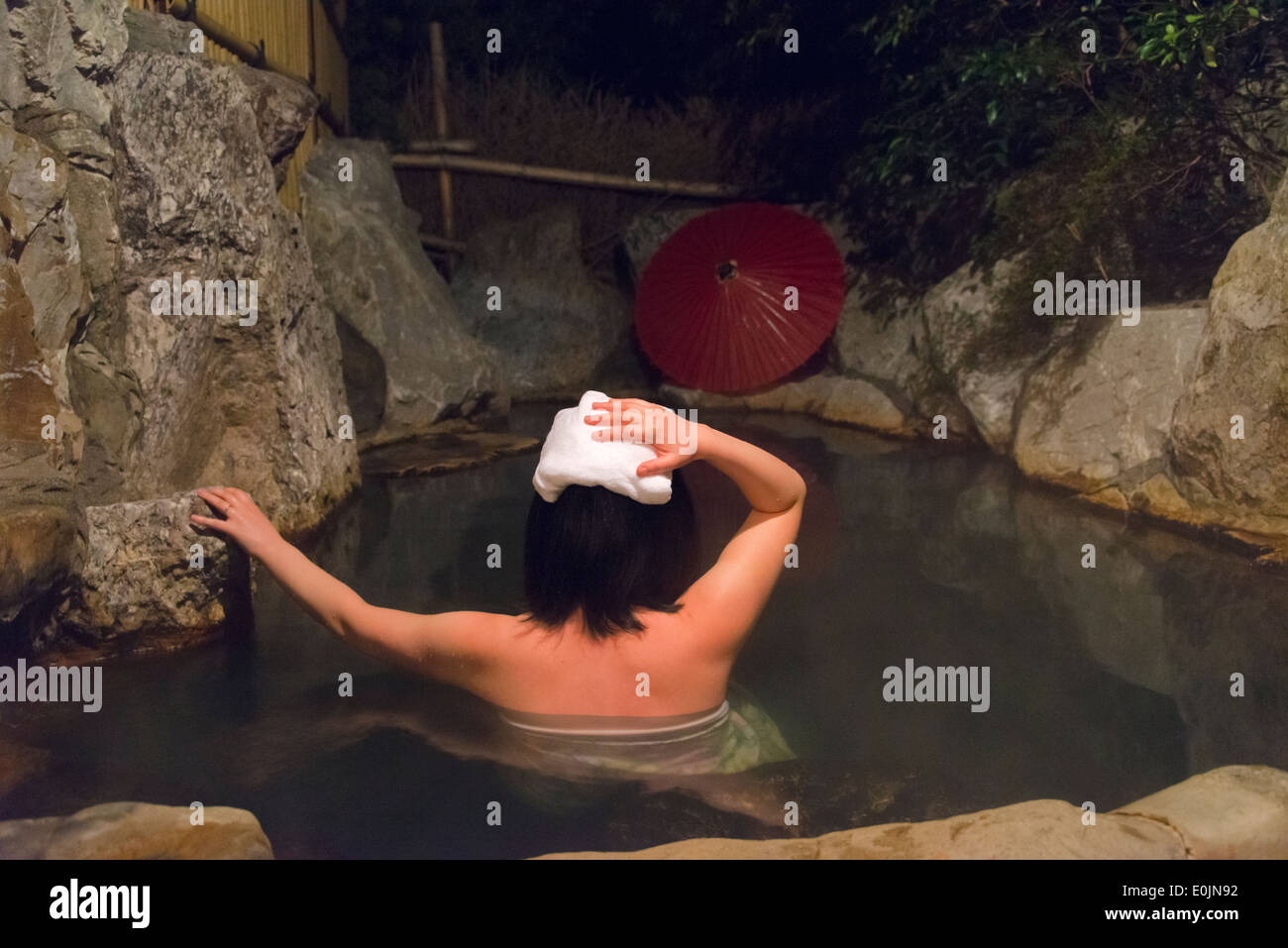 Woman in onsen, Japanese hot spring, Aso, Kumamoto, Kyushu, Japan Stock Photo