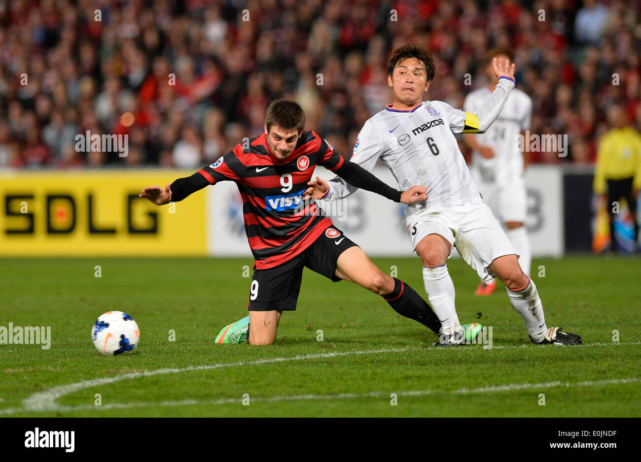 Sydney, Australia. 14th May, 2014. Wanderers forward Tomi Juric and Hiroshima midfielder Toshihiro Aoyama in action during the AFC Champions League game between Western Sydney Wanderers FC and Sanfrecce Hiroshima FC of Japan from the Pirtek Stadium, Parramatta. The Wanderers won 2-0 and progress on the away goal rule. Credit:  Action Plus Sports/Alamy Live News Stock Photo
