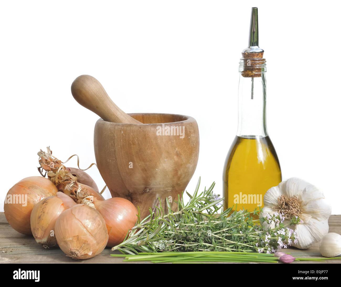 Aromatic herbs, onions, garlic and oil bottle for seasoning Stock Photo