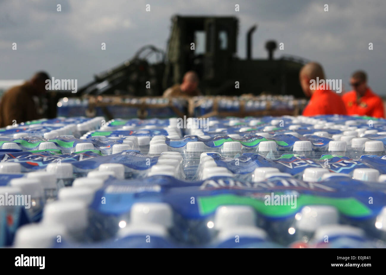 Marines with III Marine Expeditionary Force secure a palette of bottled