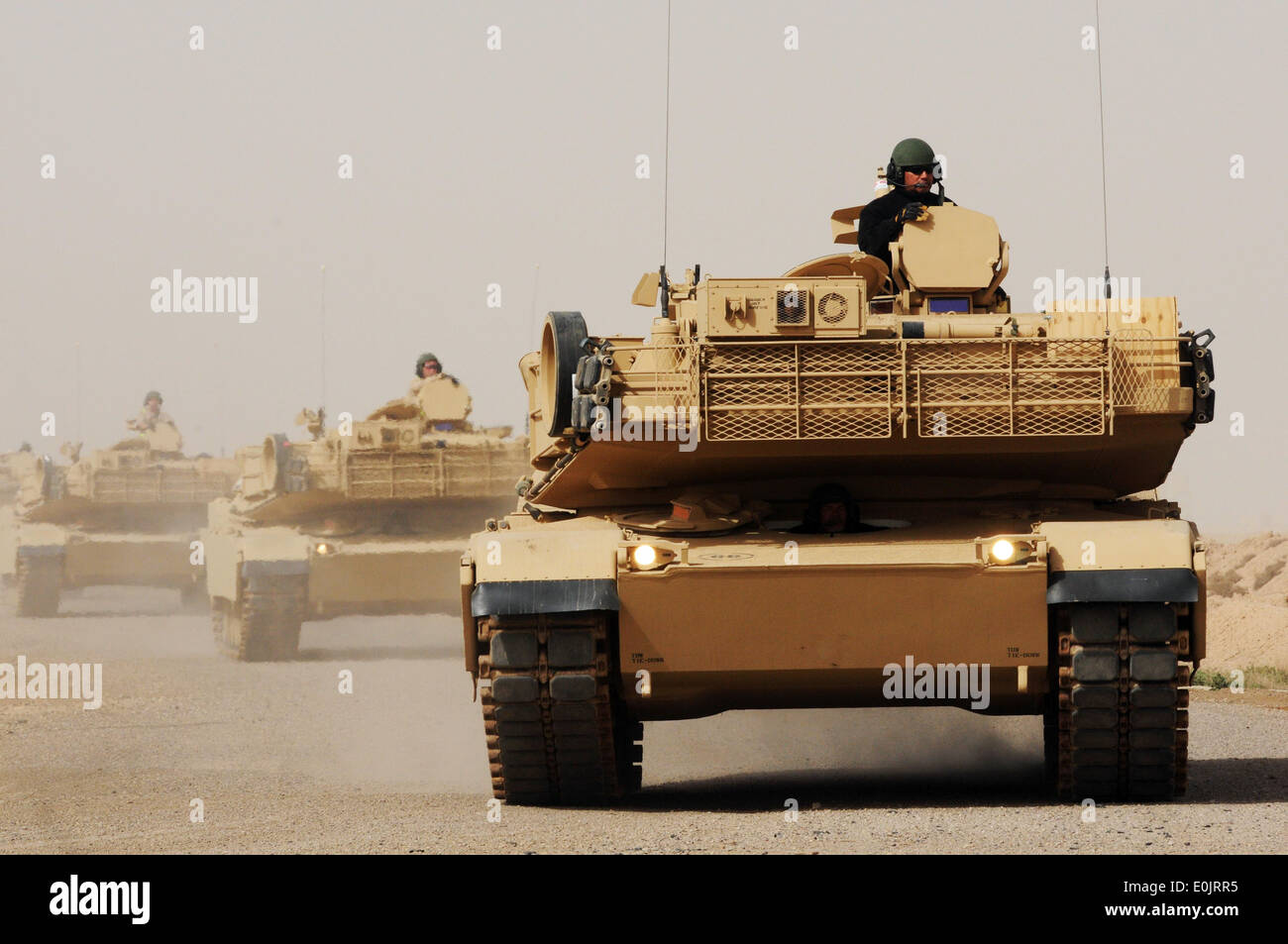 Learning how to drive the M1A1 Abrams Main Battle Tank as part of an armored column is one of the many skills Iraqi Army soldie Stock Photo