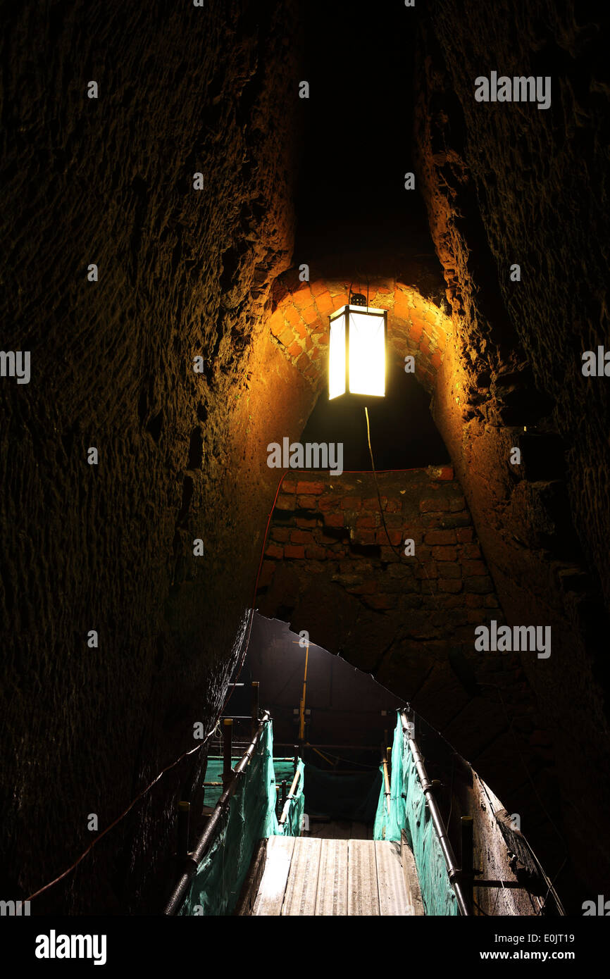 A lamp and walkway within the Williamson Tunnels in Liverpool, United Kingdom. Stock Photo