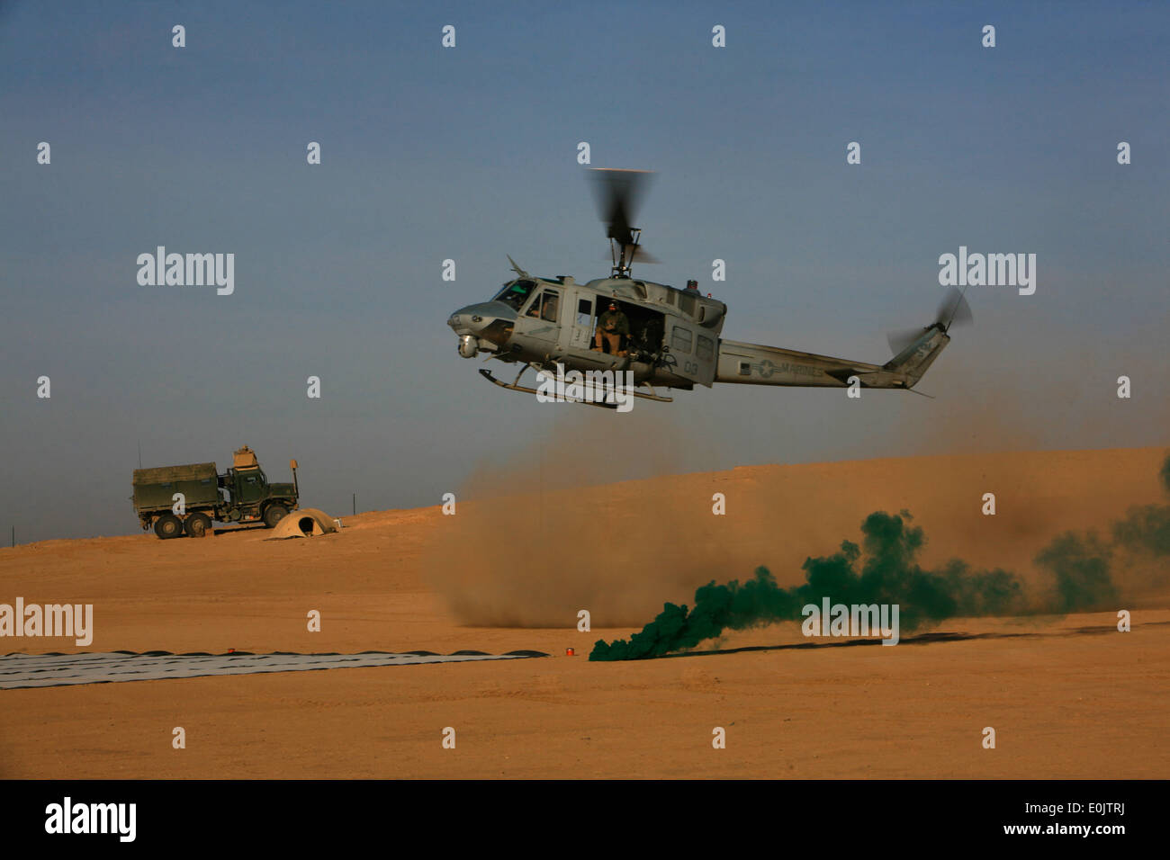 A UH-1 Huey helicopter lands at the Jump Command Post in Ninewa, Iraq ...