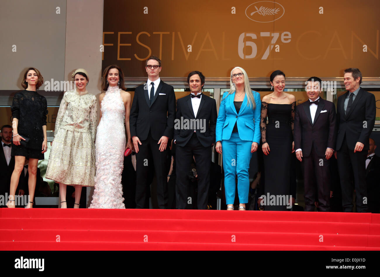 (L-R) Jury members, US director Sofia Coppola, Iranian actress Leila Hatami, French actress Carole Bouquet, Danish director Nicolas Winding Refn, Mexican actor Gael Garcia Bernal, New Zealand director Jane Campion, Korean actress Jeon Do-yeon, Chinese director Jia Zhangke and US actor Willem Dafoe arrive for the screening of the movie 'Grace of Monaco' and the Opening Ceremony of the 67th annual Cannes Film Festival in Cannes, France, 14 May 2014. Presented out of competition, the movie opens the festival which runs from 14 to 25 May. Photo: Hubert Boesl - NO WIRE SERVICE Stock Photo