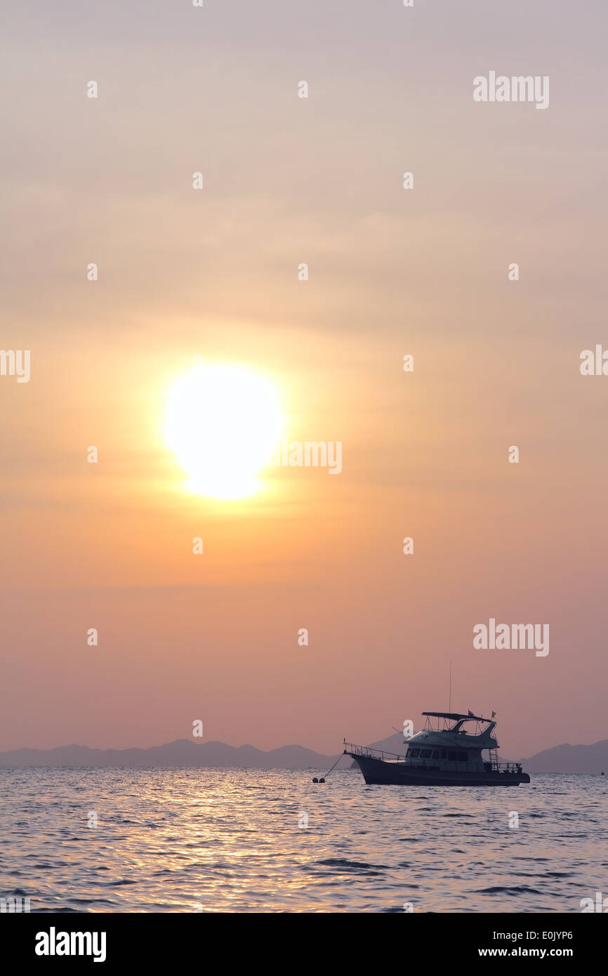 Sailing yaht in open sea on beautiful sunset sky background Stock Photo ...