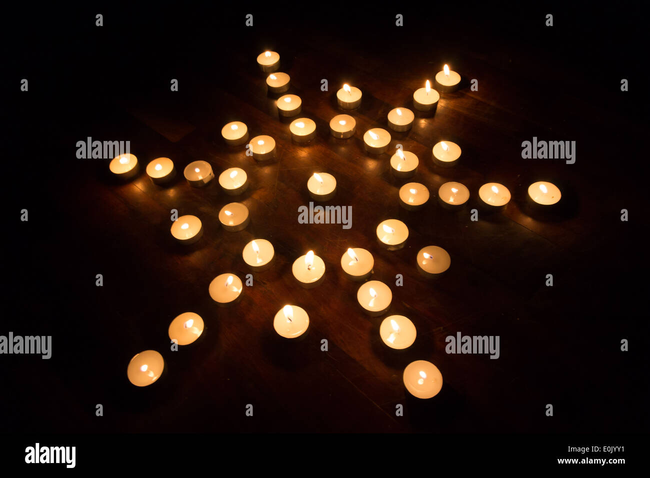 candle forming sun sign Stock Photo Alamy