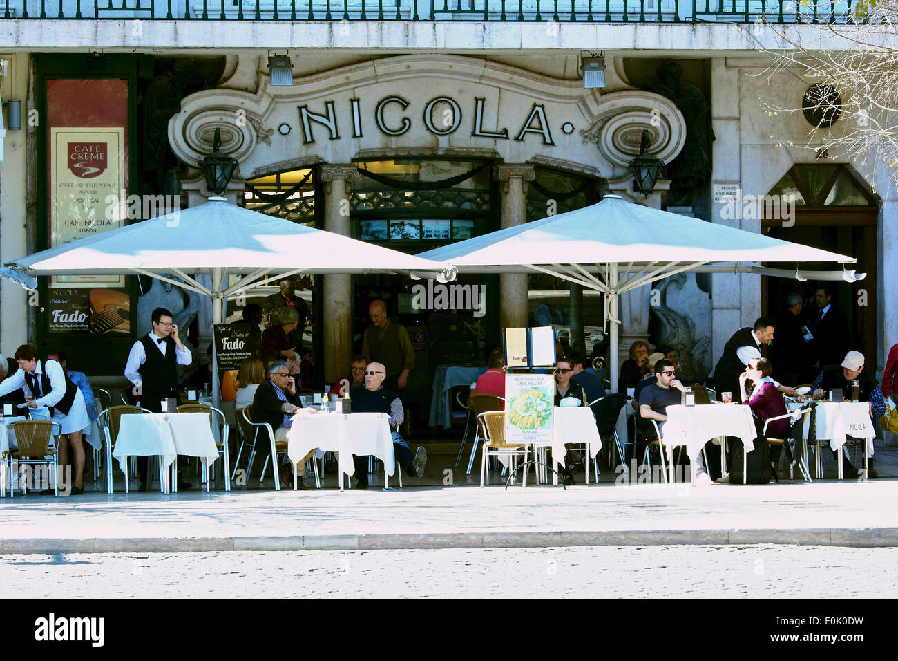 Alfresco cafe culture at busy Art Deco Nicola on Rossio Square (Praca Dom Pedro 1V) Lisbon Portugal western Europe Stock Photo