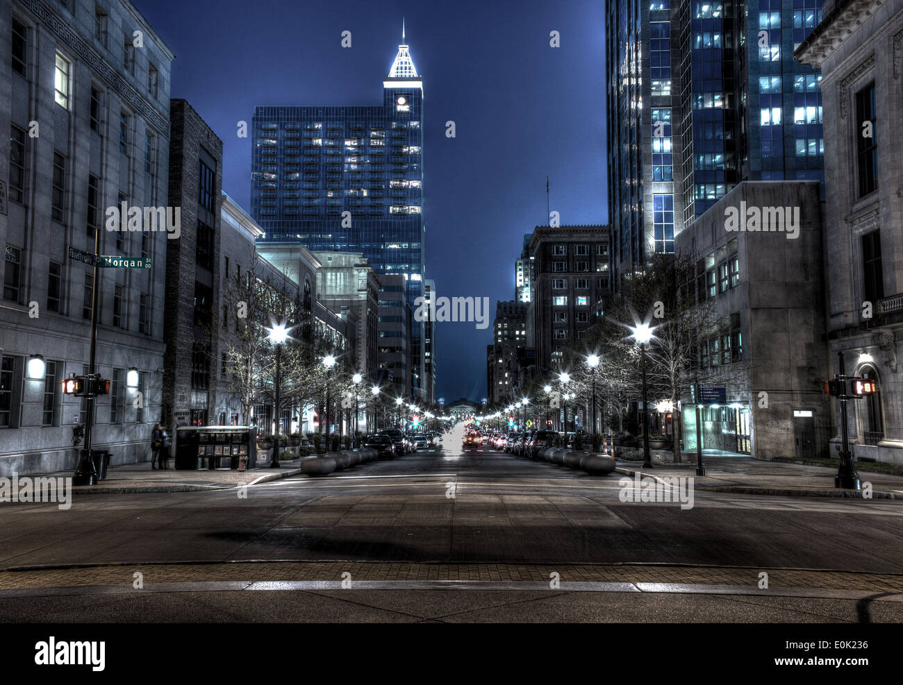 Downtown City at night with lights from cars passing by Stock Photo