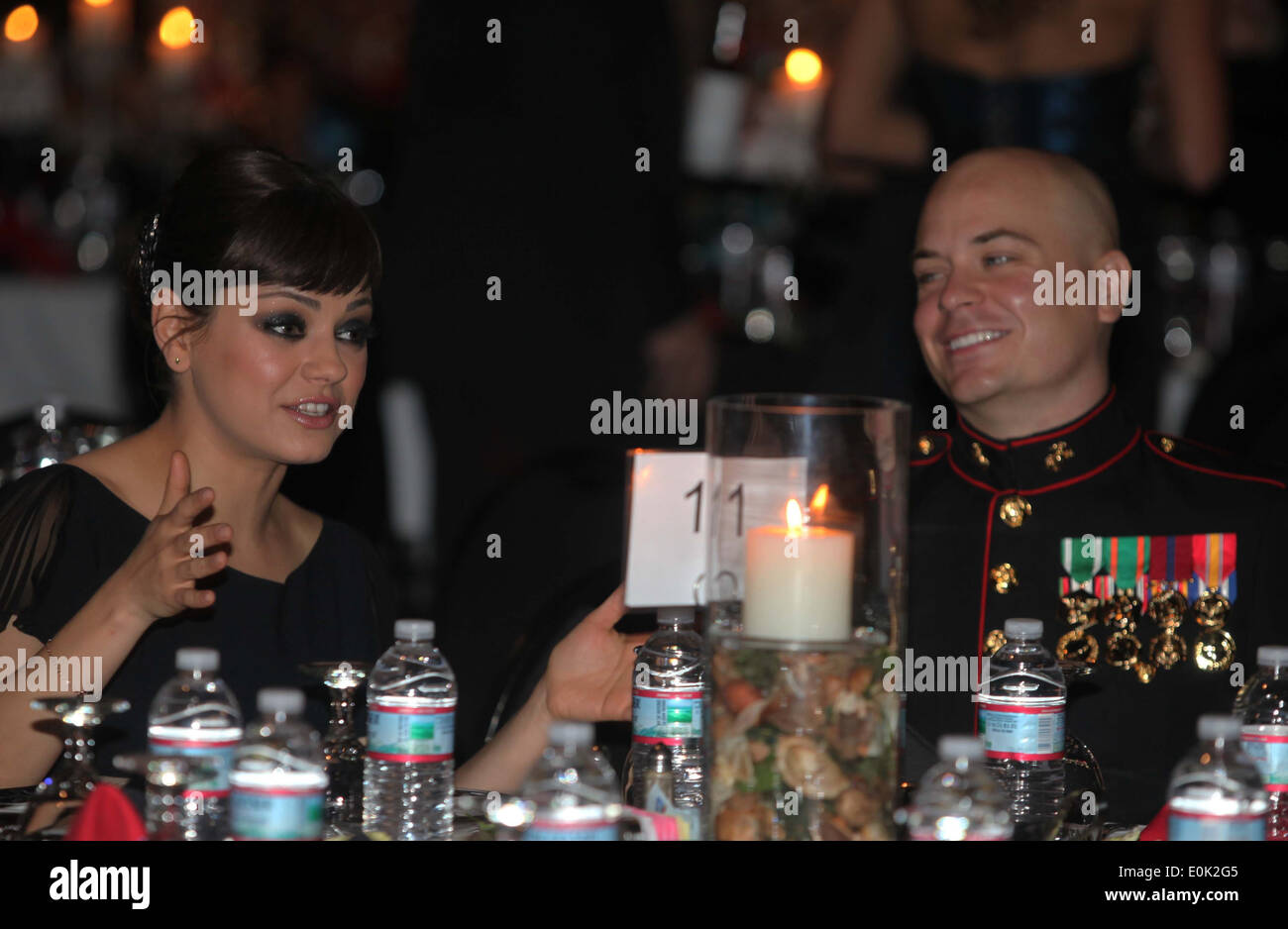 Sgt. Scott Moore and his guest, actress Mila Kunis attend the 236th Marine Corps birthday ball for 3rd Battalion, 2nd Marine Re Stock Photo