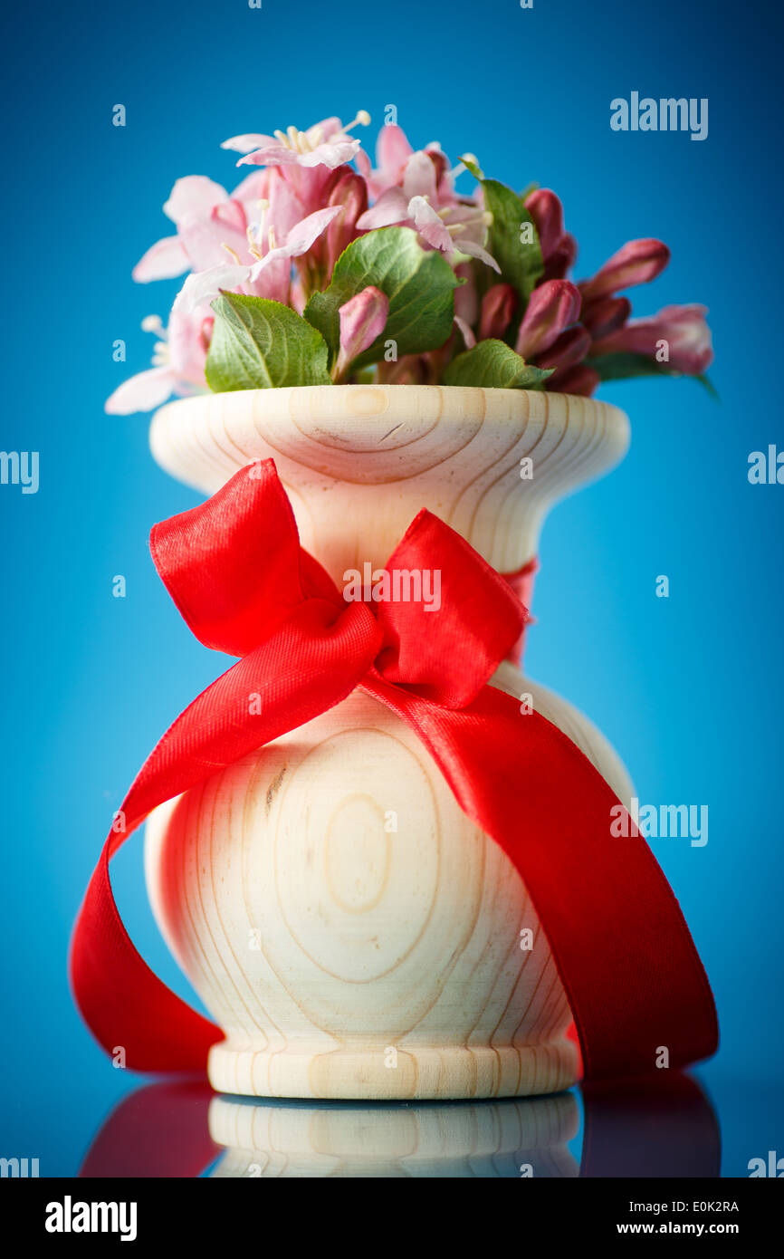 Weigela blooming beautiful wood vase on the table Stock Photo Alamy