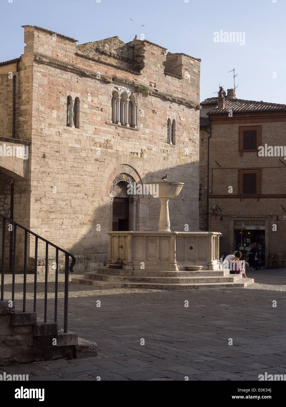 Bevagna, Umbria, Italy; view of the Romanesque church of San Silvestro and the fountain Stock Photo