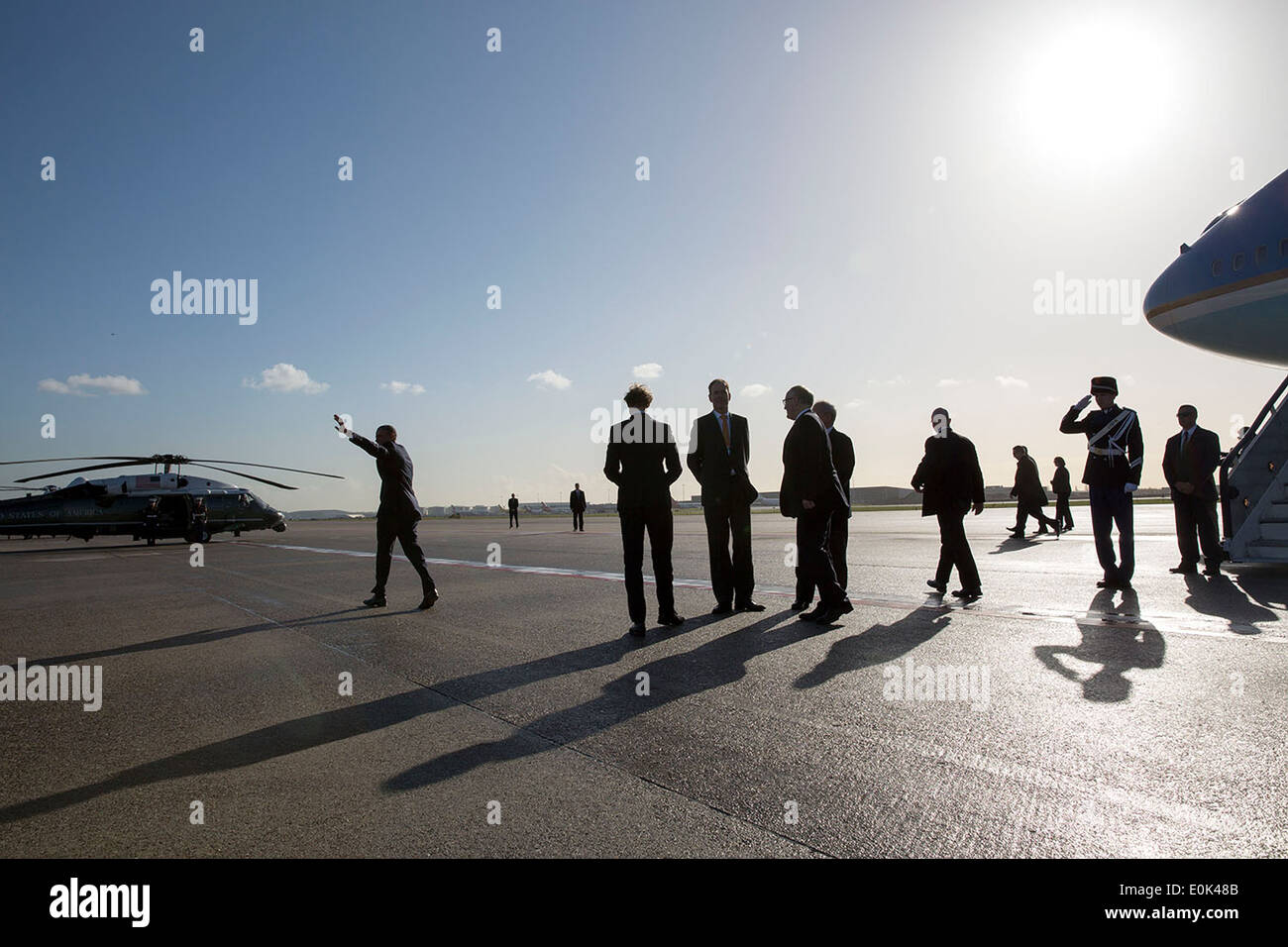 US President Barack Obama waves to supporters as he walks to Marine One after arrival at Schiphol International Airport March 24, 2014 in Amsterdam, Netherlands. Stock Photo
