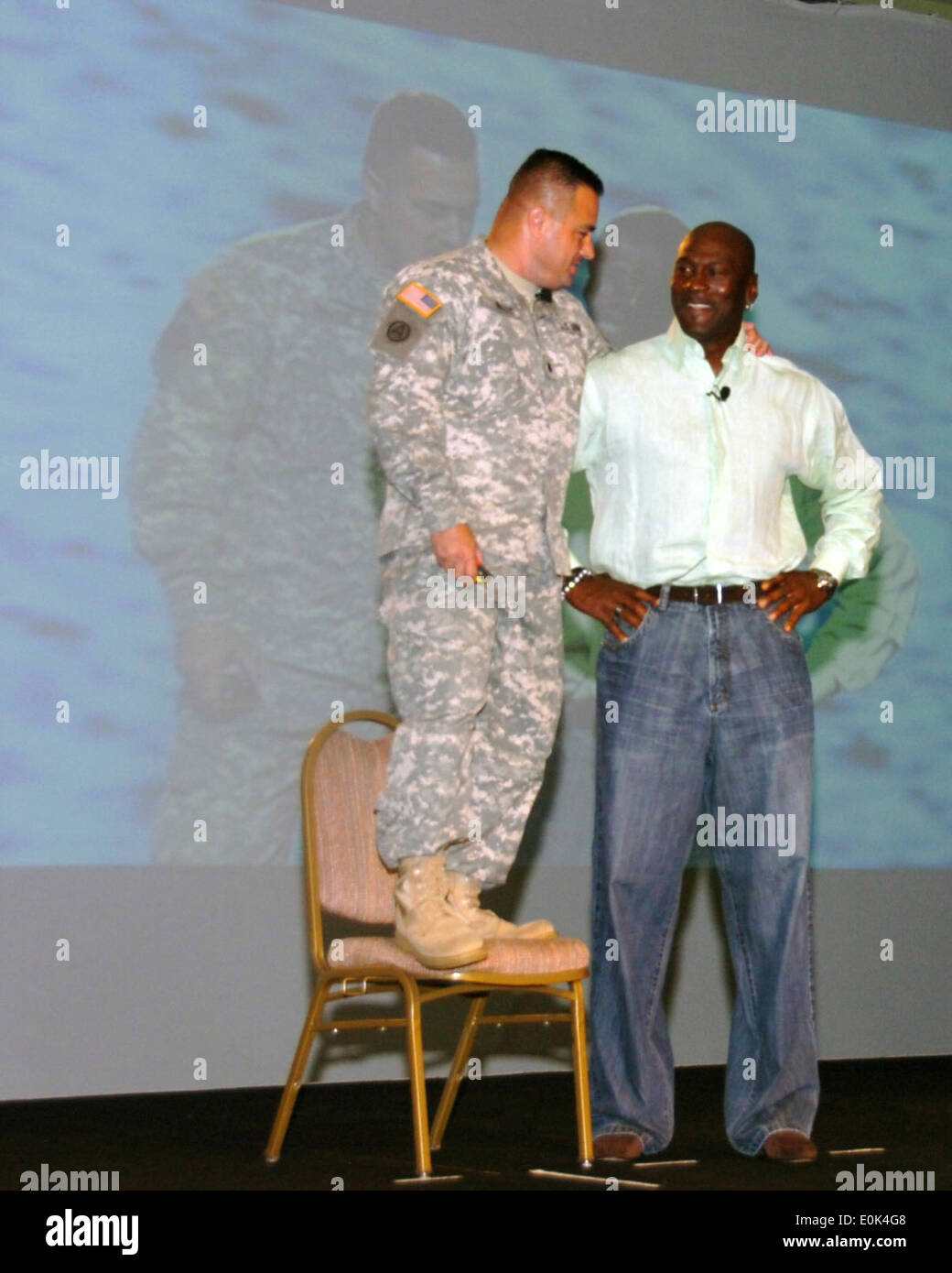 081009-A-3715G-147: A National Guard Citizen-Soldier compares himself to 6-foot-6 Michael Jordan in Orlando, Fla., as the NBA l Stock Photo