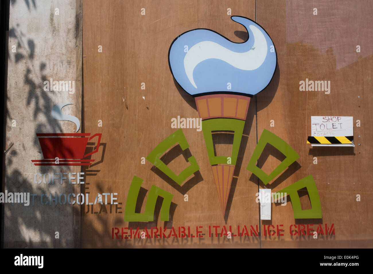 The window of a closed local Italian ice cream business in south London