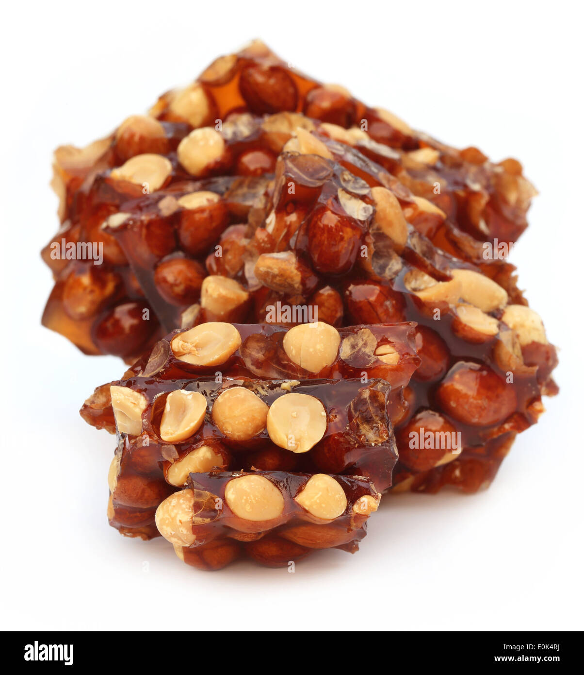 Jaggery Candy with peanuts over white background Stock Photo Alamy