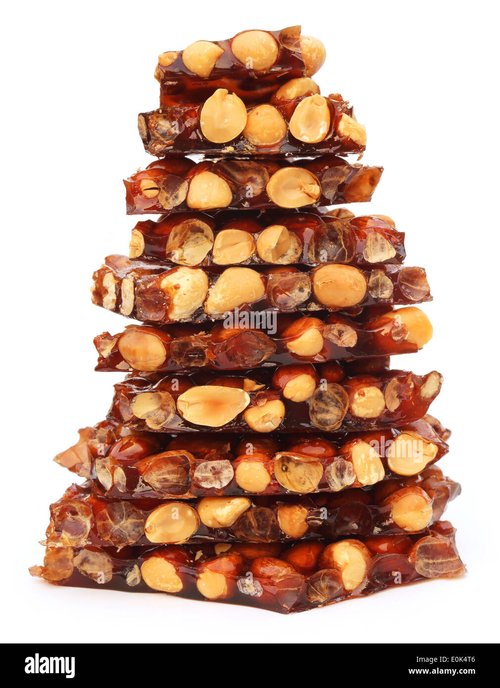 Jaggery Candy with peanuts over white background Stock Photo Alamy