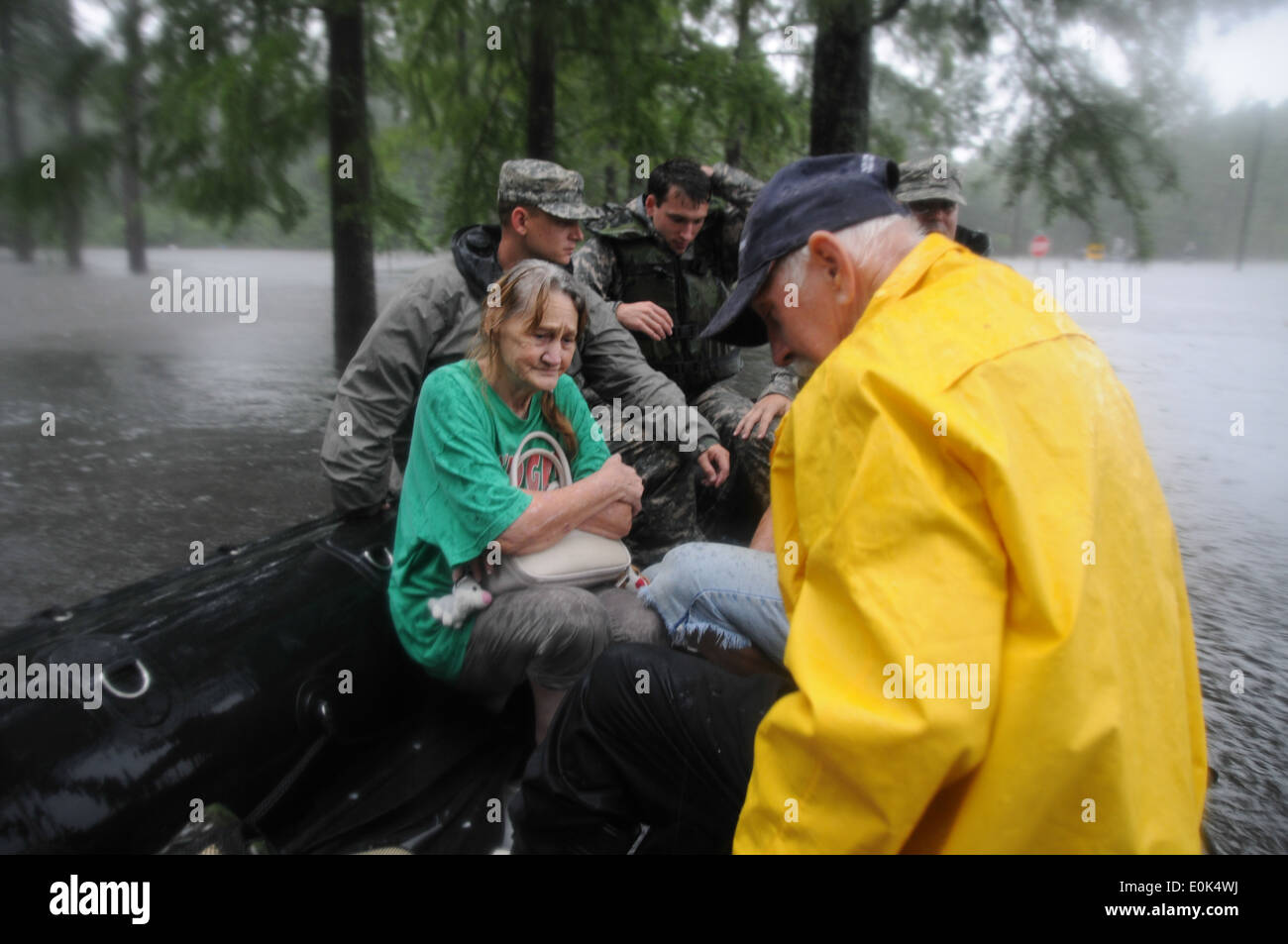 Members of Support Company, 2nd Battalion, 20th Special Forces Group are searching through flooded areas in Moss Point, Miss. f Stock Photo