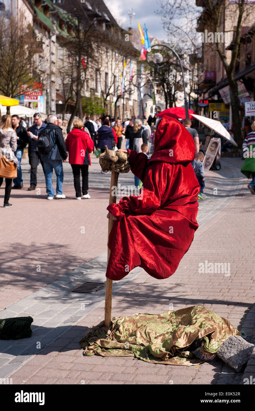Girl levitate in Zakopane Krupowki Street Stock Photo