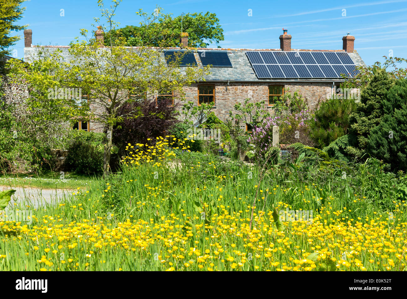 Solar Panels and rooftop heat exchanger for hot water on a period property in Cornwall, Southern England, UK Stock Photo
