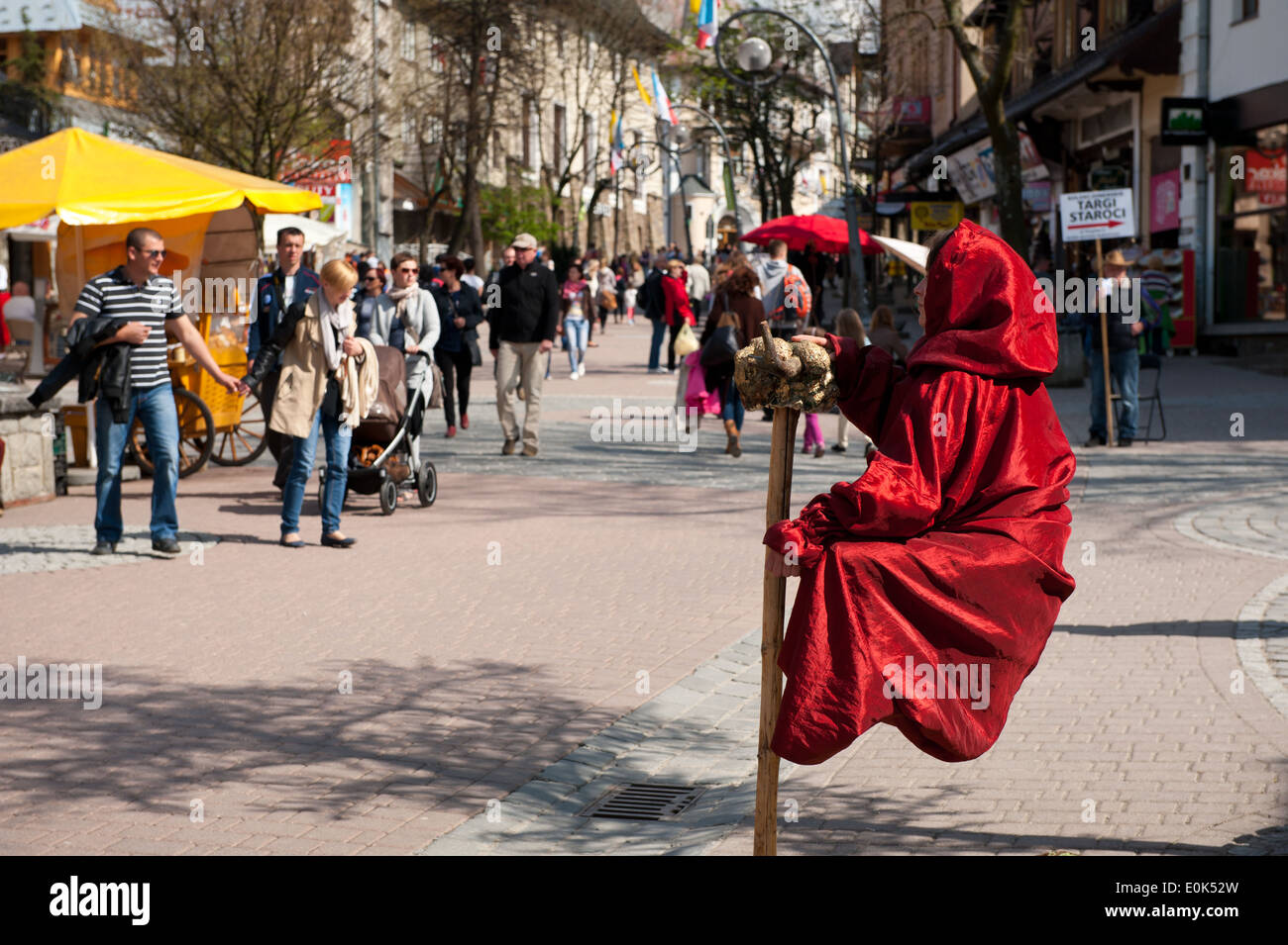 Magic trick levitate girl in Zakopane Krupowki Street Stock Photo