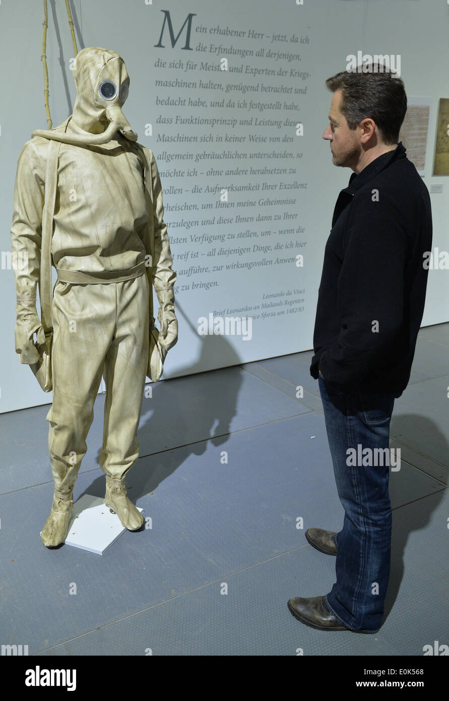 Bremen, Germany. 14th May, 2014. An employee looks at a diving suit