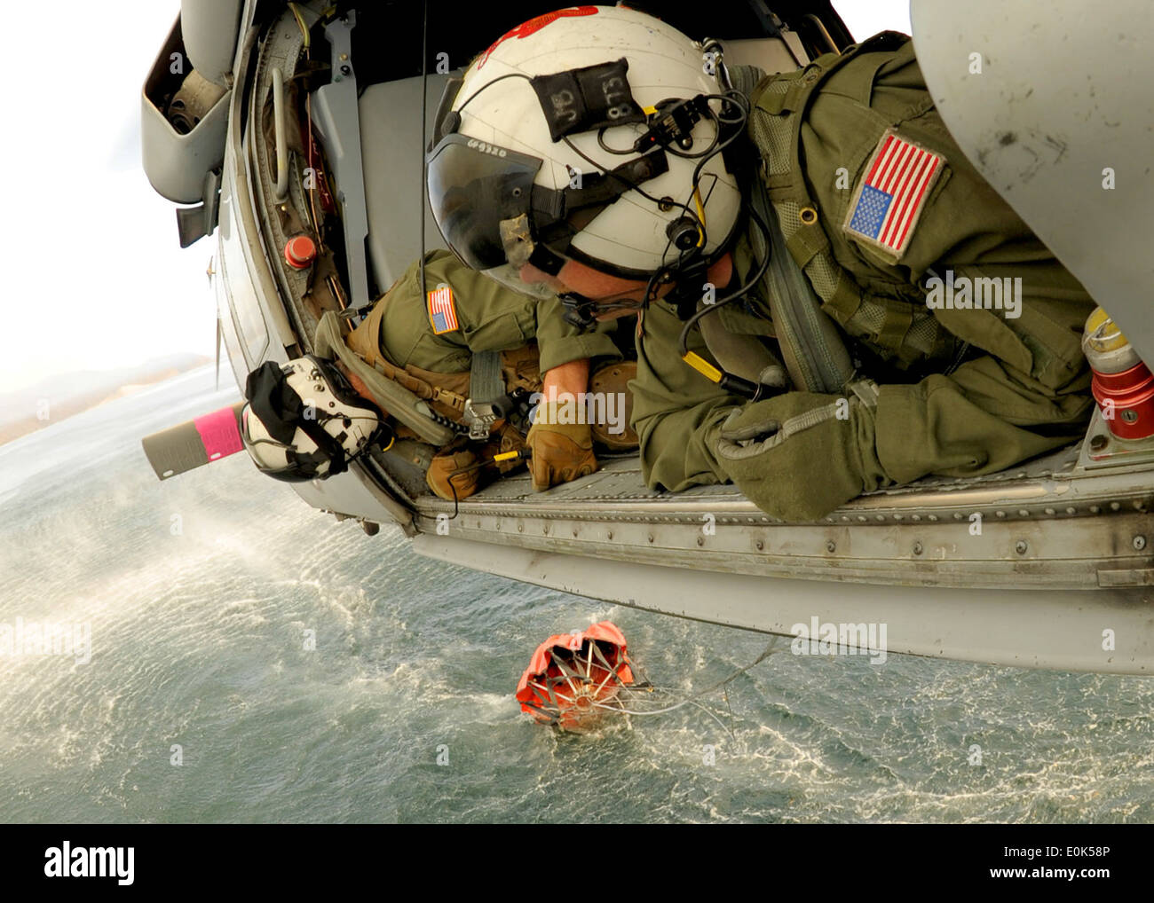 From back, Navy Aviation Warfare Systems Operators Chief Jay Okonek and 1st Class Petty Officer Jason Blase, aircrewmen from th Stock Photo