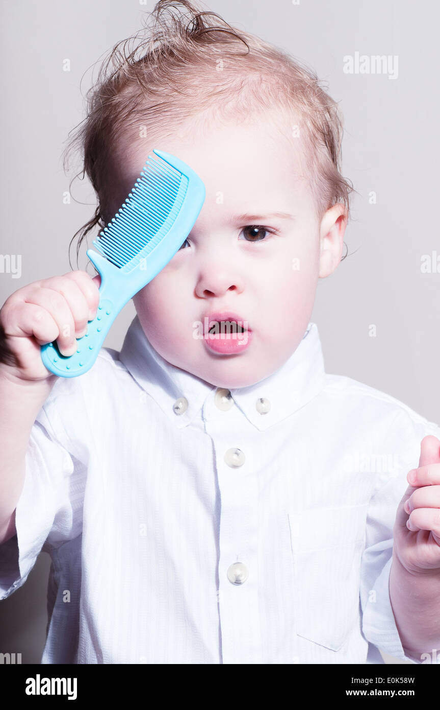 Boy combing hair hires stock photography and images Alamy