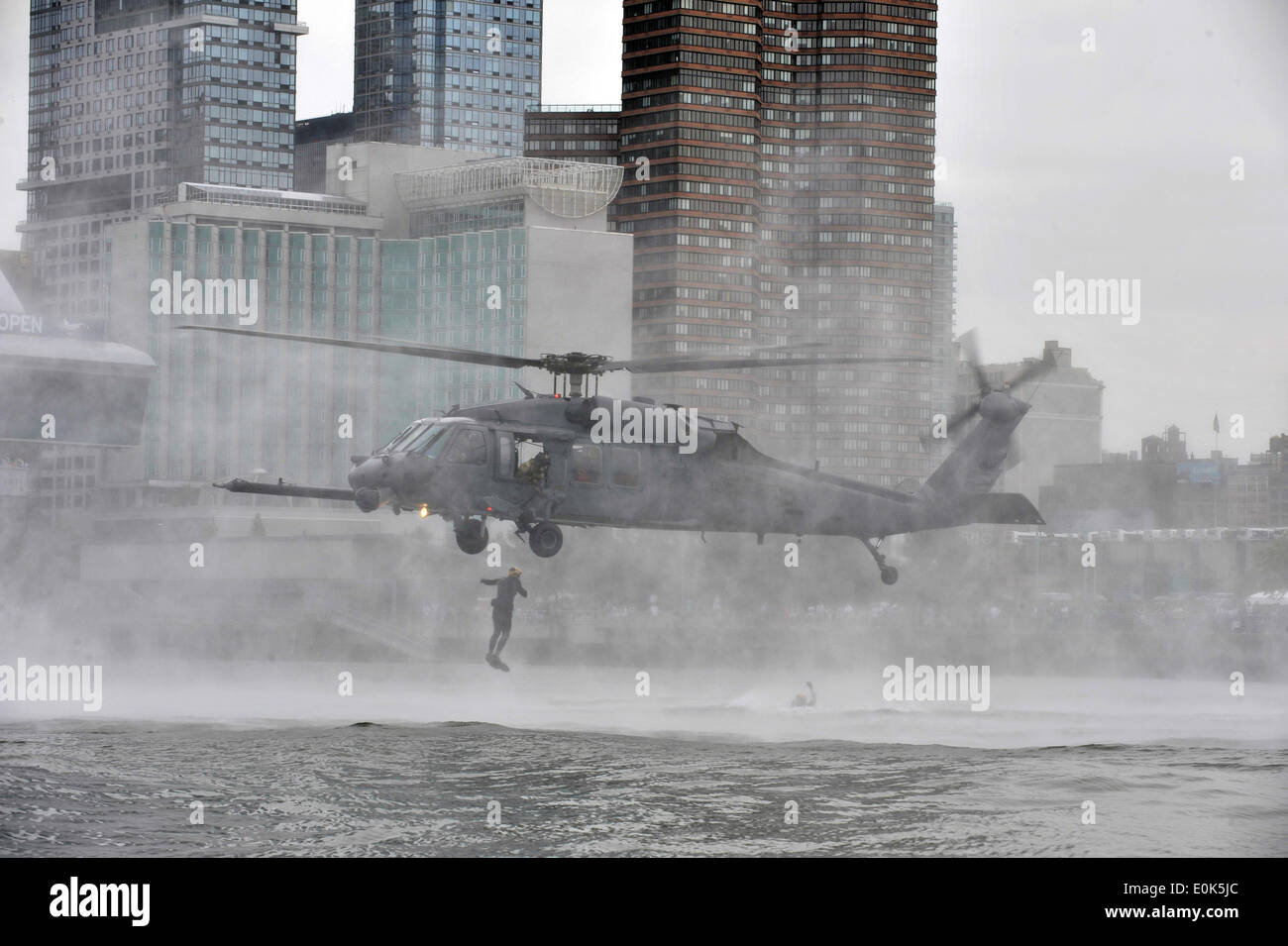An HH-60 Pave Hawk helicopter from the New York Air National Guard's 106th Rescue Wing conducts a mock water rescue during an a Stock Photo