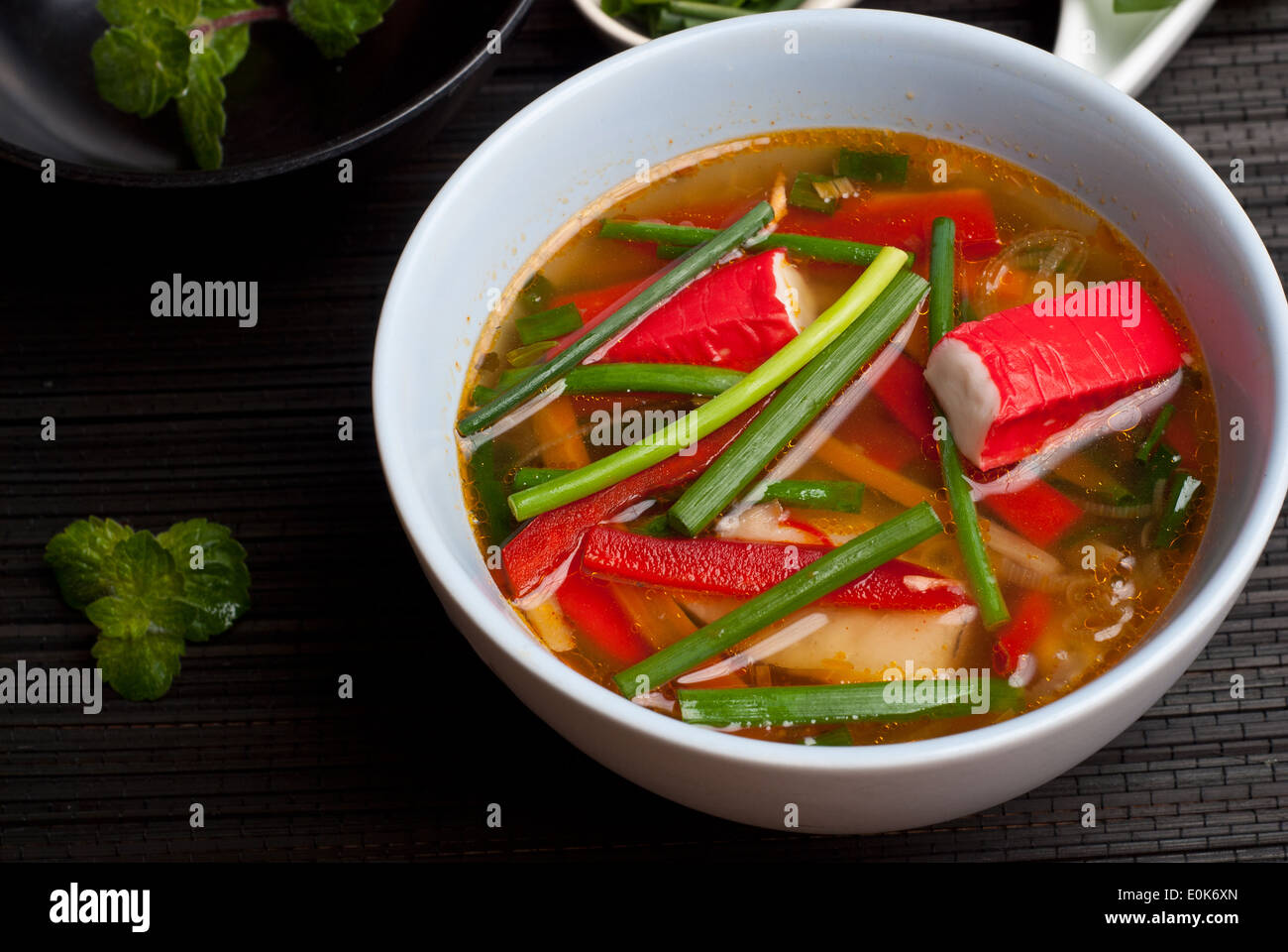 East style surimi (kanikama) soup with rice noodles and chives Stock Photo