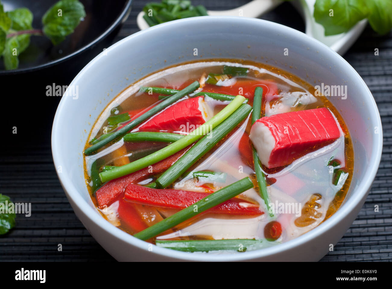 East style surimi (kanikama) soup with rice noodles and chives Stock Photo