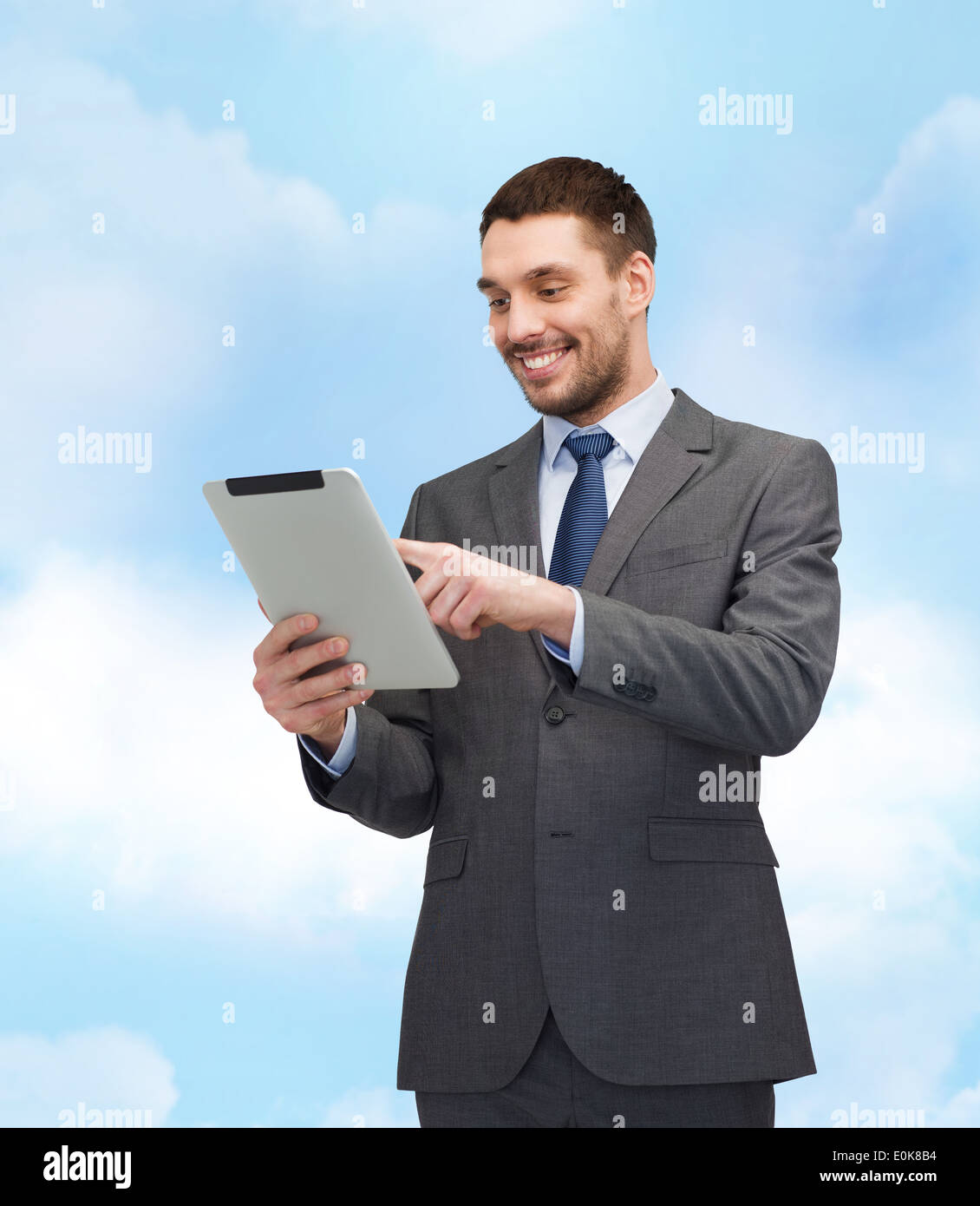 smiling buisnessman with tablet pc computer Stock Photo