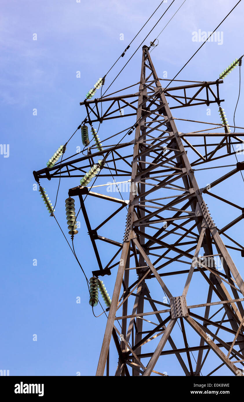 High voltage electric tower against blue sky Stock Photo - Alamy