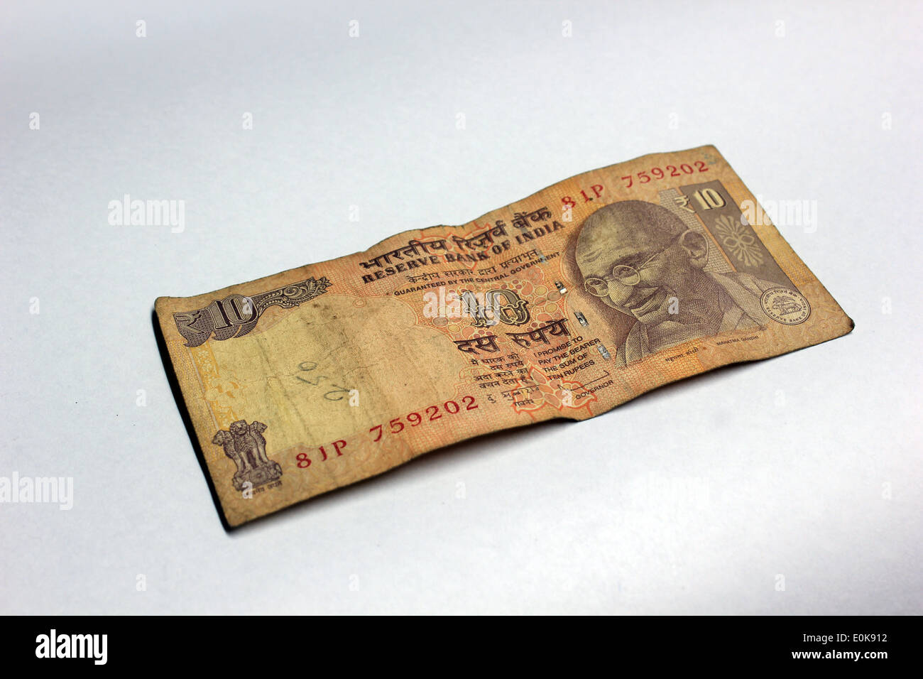 A 10 rupee note n white background Stock Photo