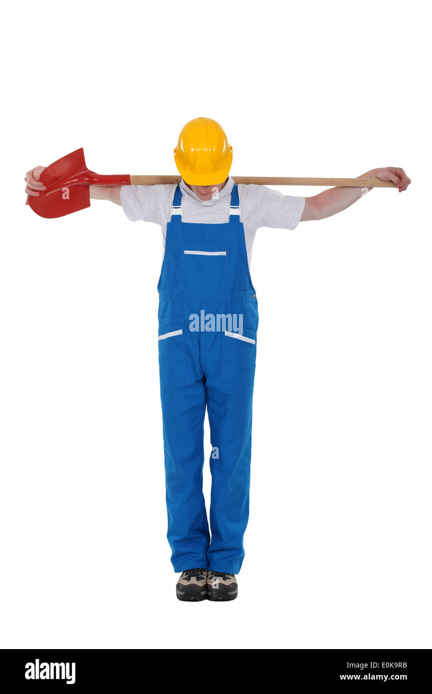 Man with shovel over his back Stock Photo