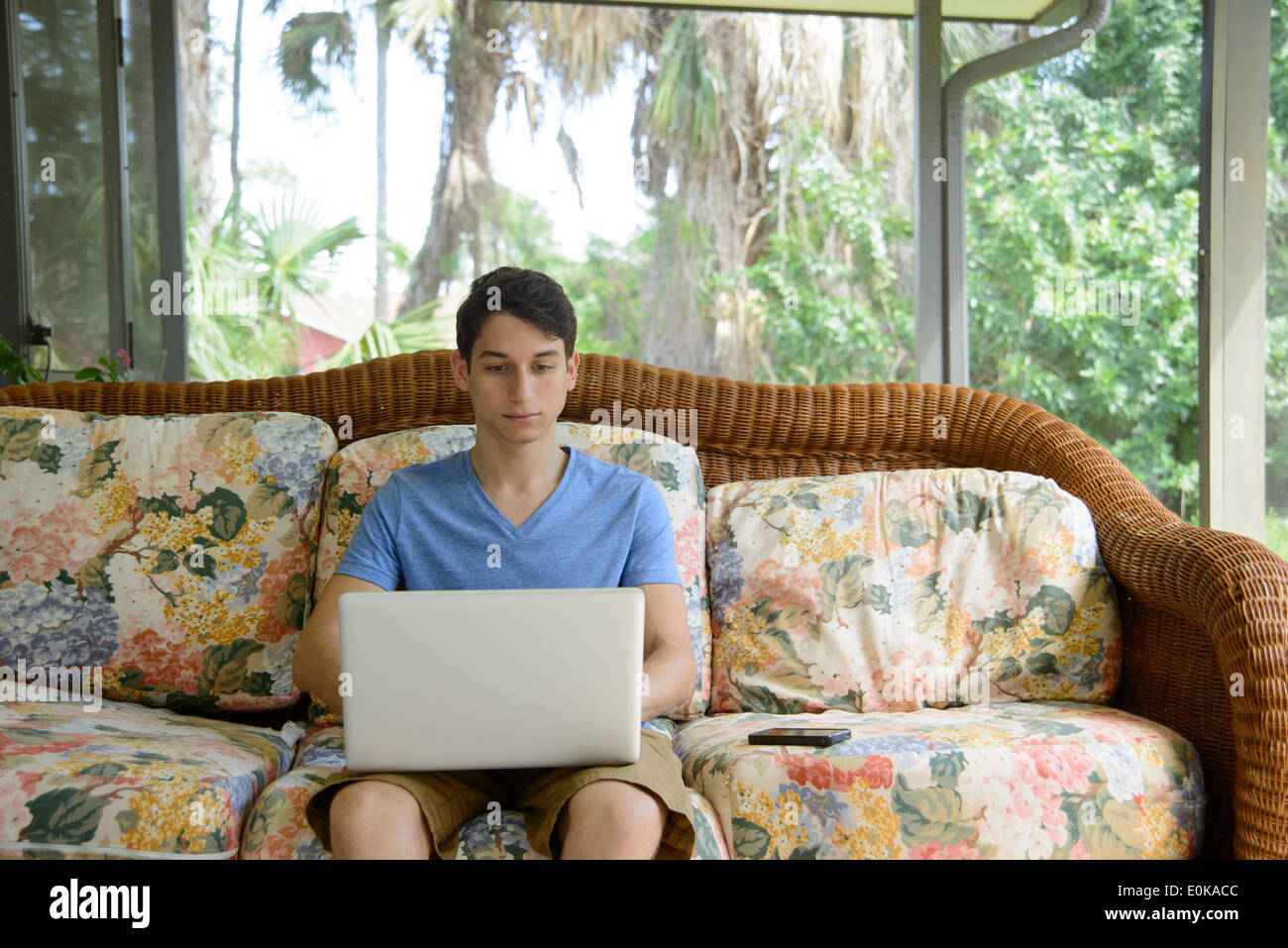 Young man using a portable computer at home Stock Photo