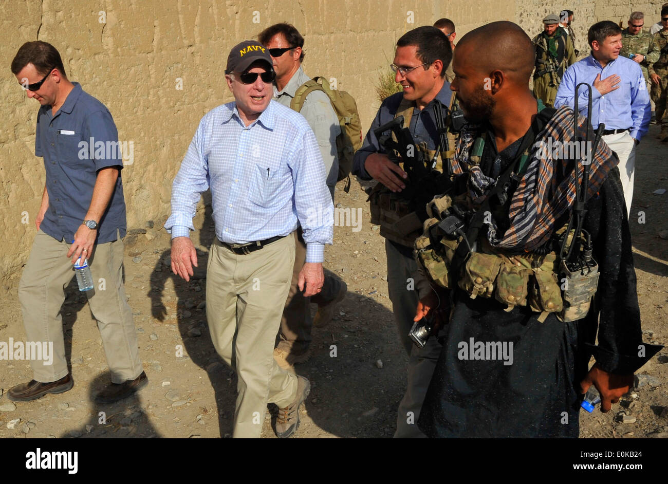 KONAR PROVINCE, Afghanistan – Sen. John McCain speaks with a U.S. Special Operations Forces team member in Mangwel village, K Stock Photo