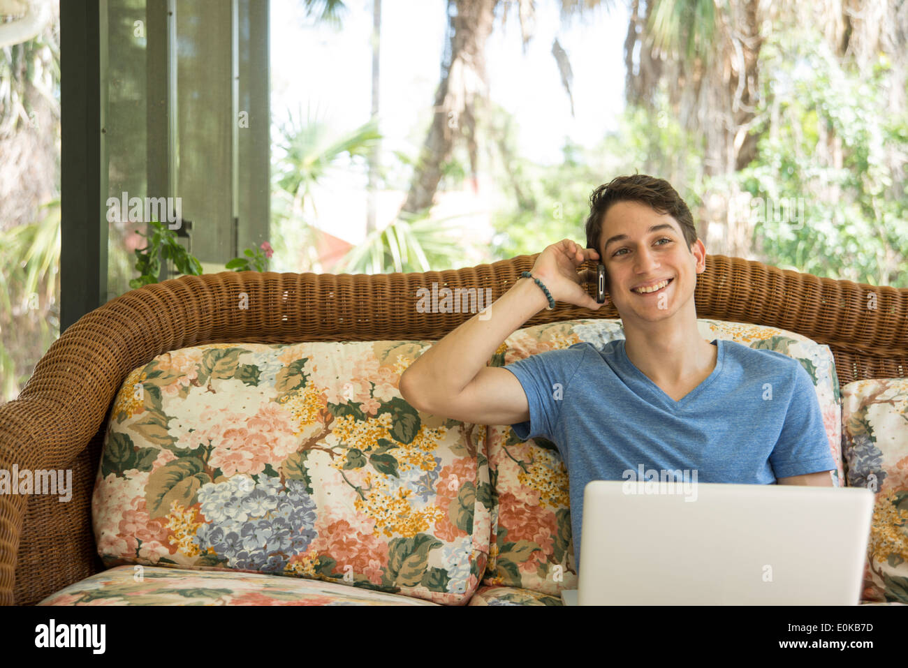 Young man using a portable computer at home Stock Photo