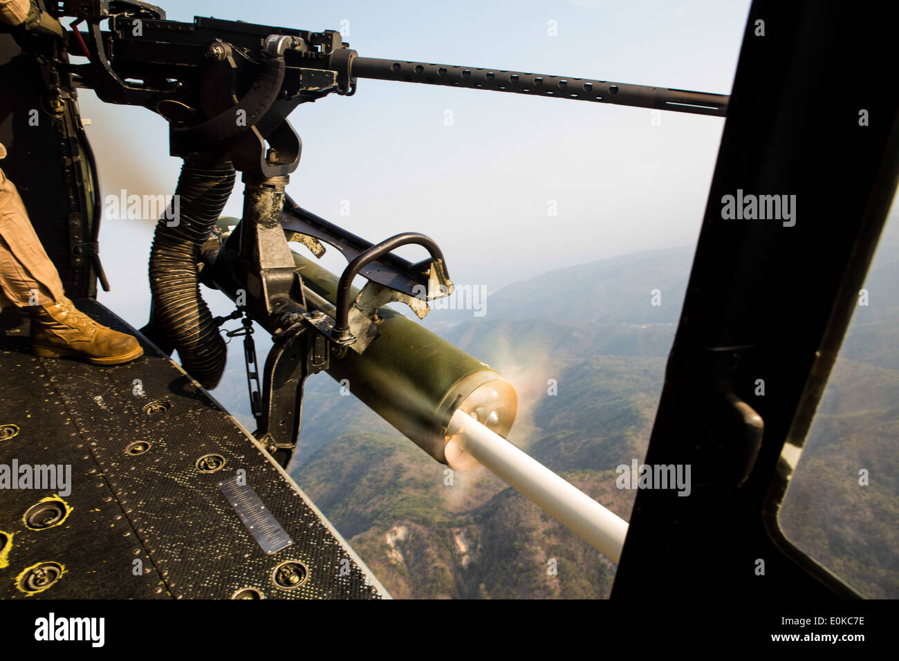 U.S. Marines with Marine Medium Tiltrotor Squadron 265 (Rein), 31st Marine Expeditionary Unit, fire 20 millimeter rounds at a g Stock Photo