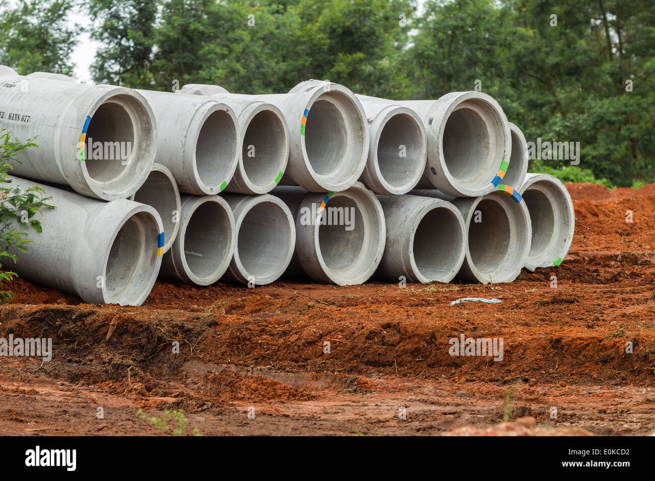 Concrete drain pipes stacked on civil engineering construction site