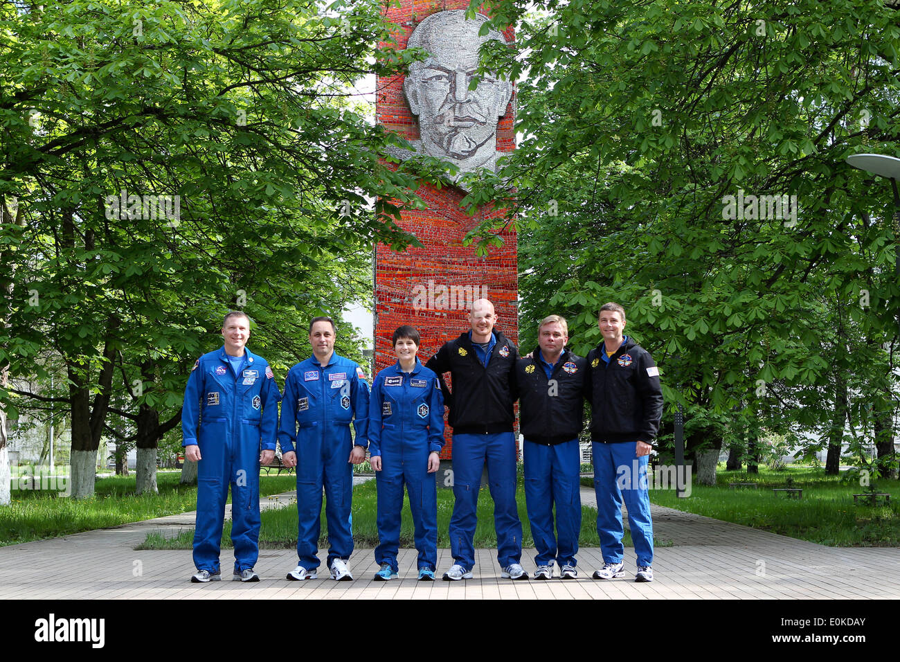 ISS Expedition 40/41 prime and backup crew members pose for pictures prior to their departure for the Baikonur Cosmodrome in Kazakhstan for final pre-launch training in front of a statue of Vladimir Lenin at the Gagarin Cosmonaut Training Center May 15, 2014 in Star City, Russia.  From left to right are backup crew members Terry Virts of NASA, Anton Shkaplerov of the Russian Federal Space Agency and Samantha Cristoforetti of the European Space Agency, and prime crew members  Alexander Gerst of the European Space Agency, Soyuz Commander Max Suraev of Roscosmos Stock Photo