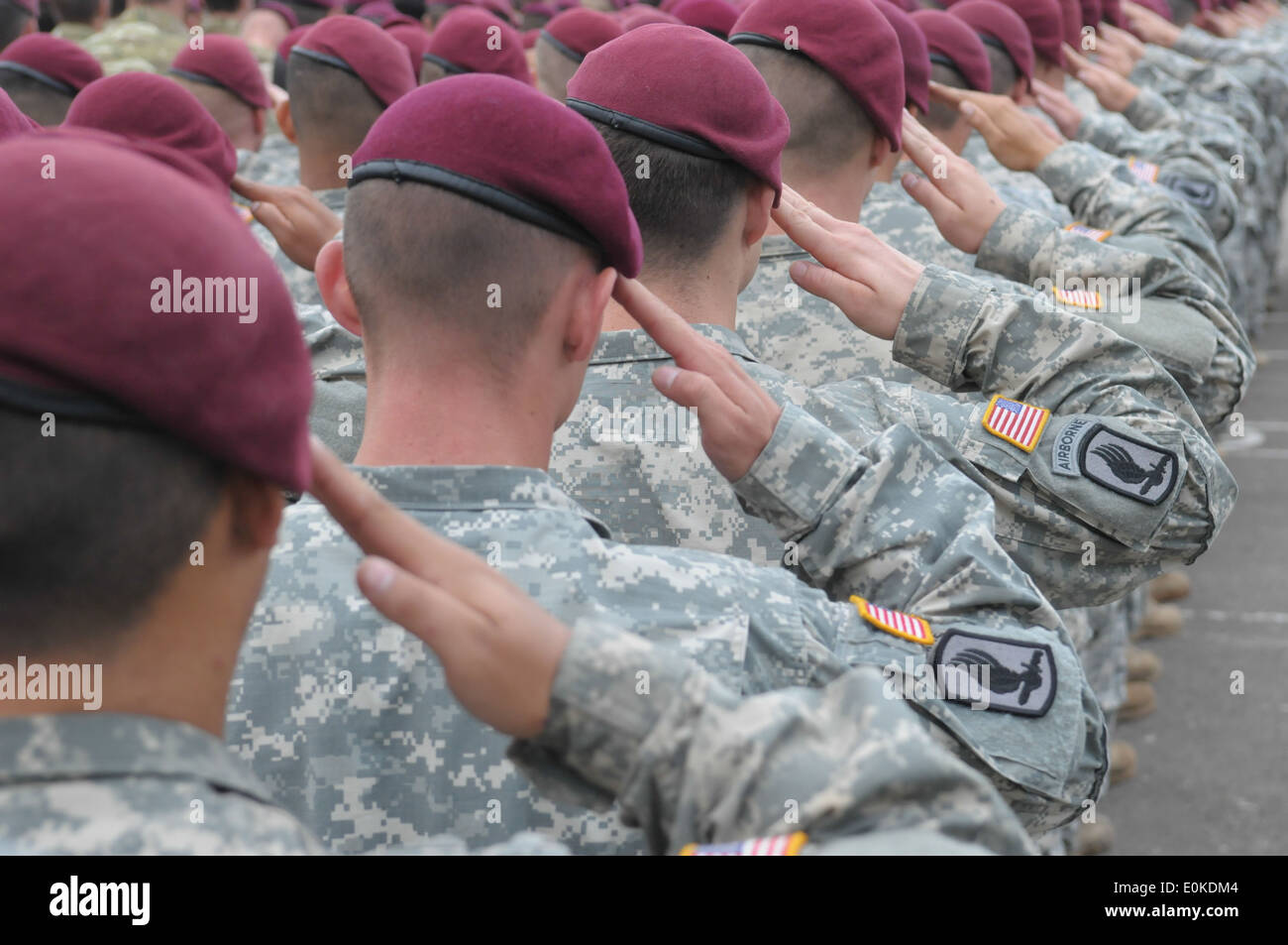 Yavoriv, U.S. paratroopers from Battle Company, 173rd Airborne Brigade Combat Team out of Vicenza, Italy render a salute during Stock Photo